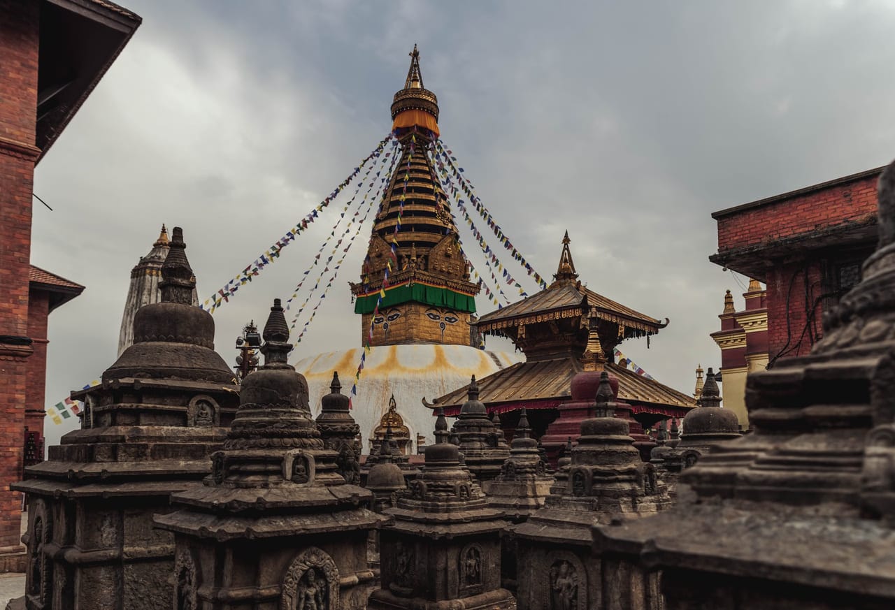 Prayer flags streaming from the stupa at Swayambhunath