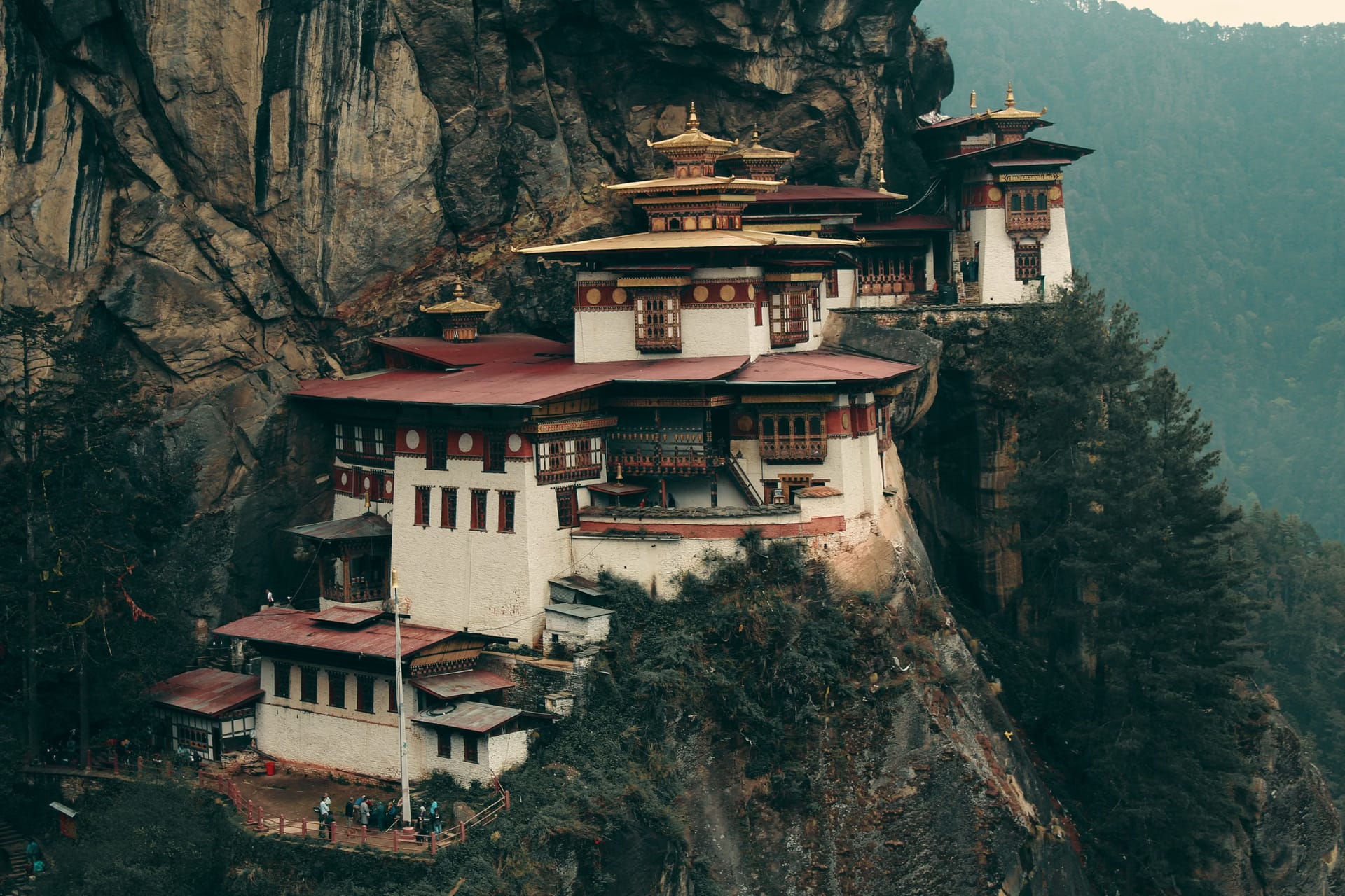 Paro Taktsang holding its cliff face high above the valley forest