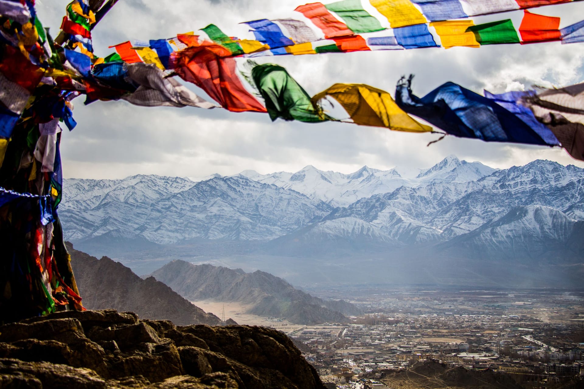 Colorful prayer flags over Himalayan peaks