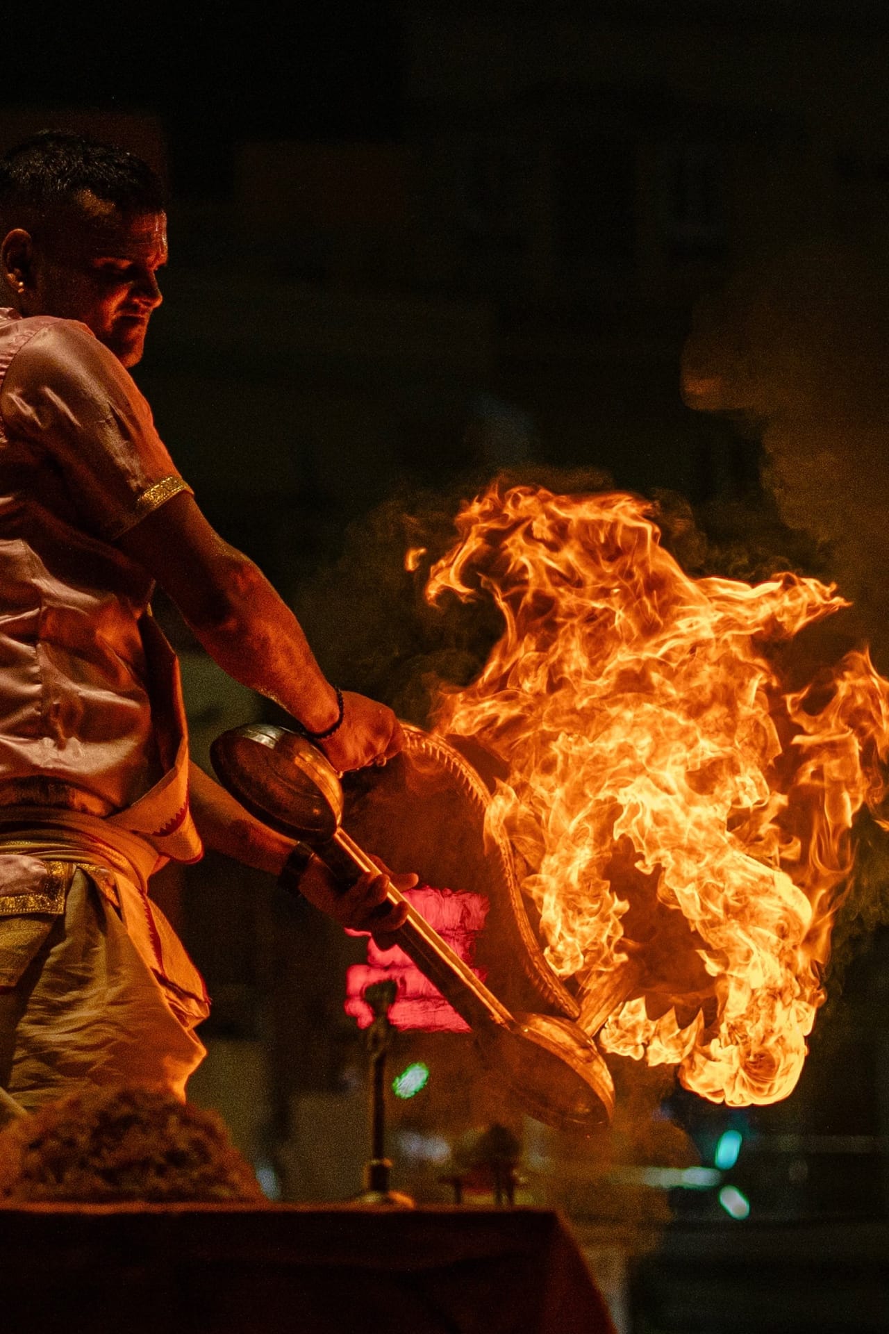 The evening aarti flame raised over the Ganges at Varanasi