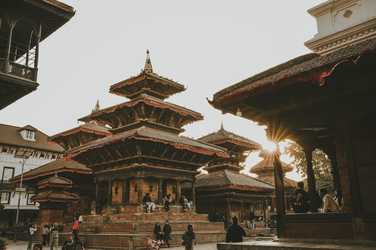 Last light on the tiered temples of Patan Durbar Square