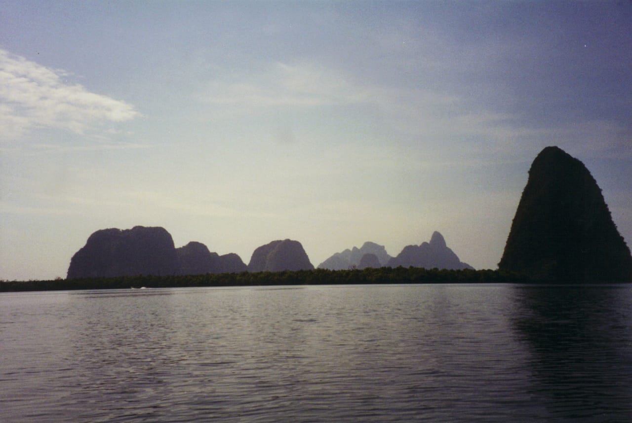 Limestone islets scattered across the calm of Phang Nga Bay