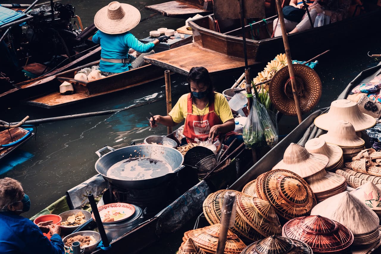 Breakfast sold from a boat at a Bangkok floating market