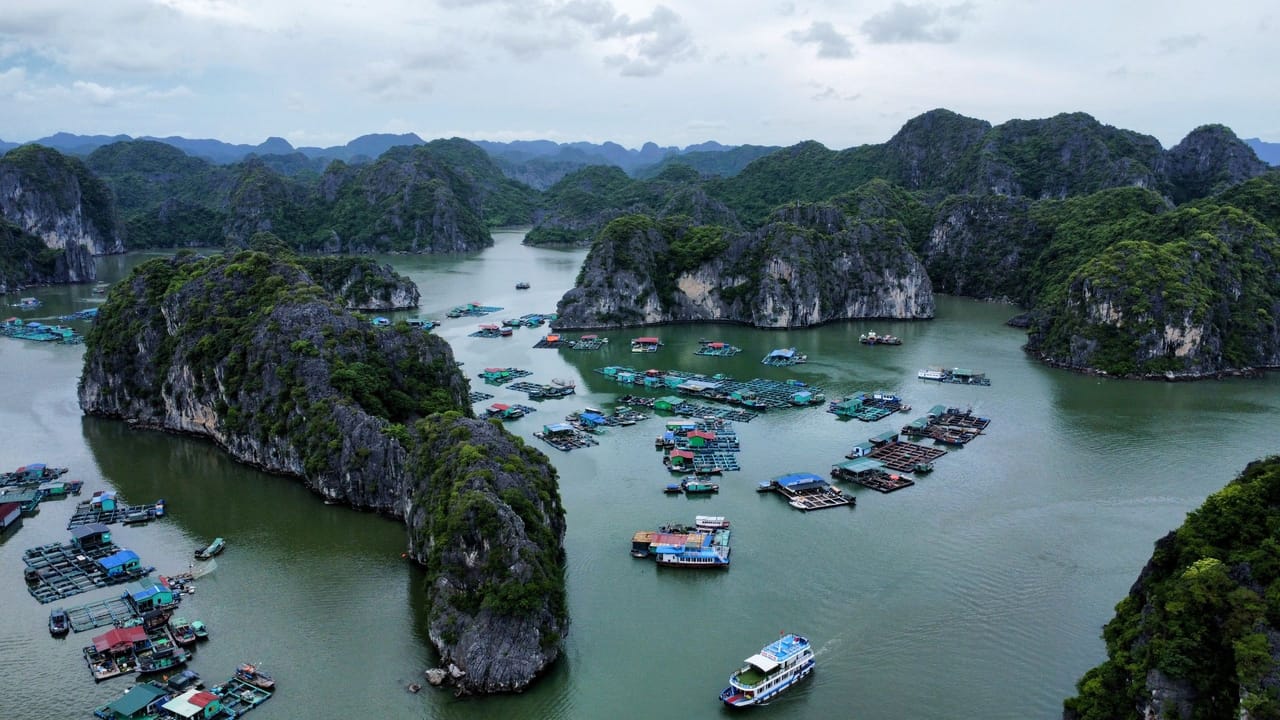Limestone karst islands rising from the water in Ha Long Bay, Vietnam