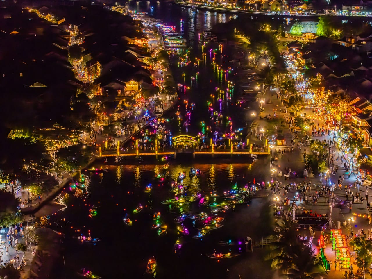Lantern-lit boats on the river in Hoi An old town, Vietnam